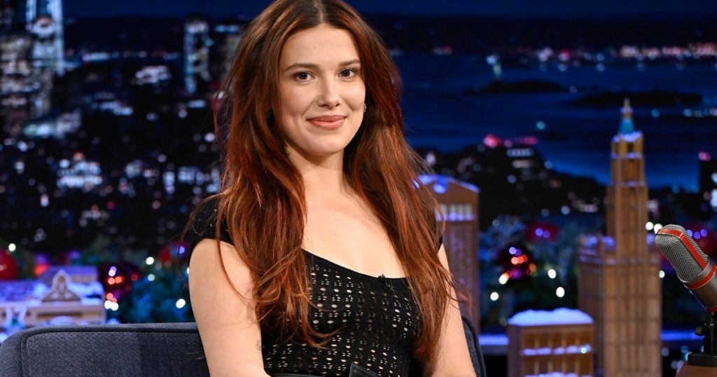 Pamja e Millie Bobby Brown me bikini të kuqe të njomur nga dielli i lë fansat të bëjnë një pamje të dyfishtë